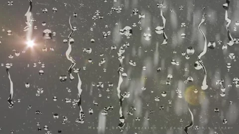 Raindrops trickling down a glass surface with glowing lens flare light effects Stock-Footage 338997183