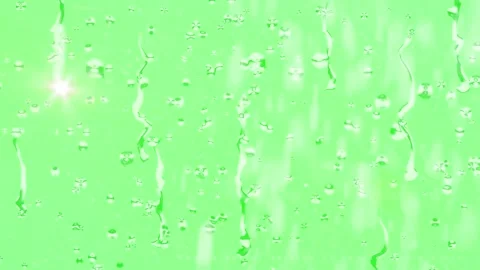 Raindrops trickling down a vibrant lime green surface creating a refreshing Видео 338997318