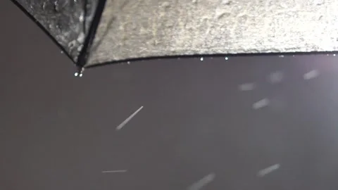 Raindrops on the umbrella raindrops falling. Black umbrella with raindrops slow Stock Footage 262296437