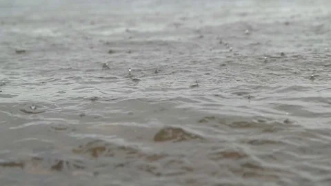 Raindrops on water in slow motion Stock Footage 76492392