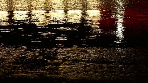 The raindrops on water surface in the night Stock Footage 127320050