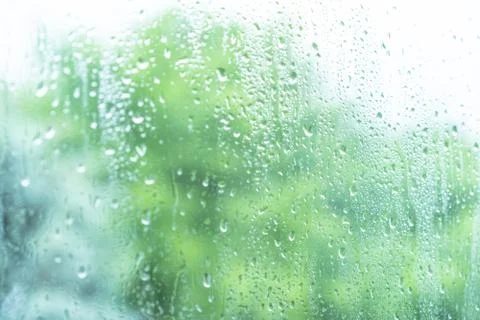 Raindrops on wet window pane Stock Photos
