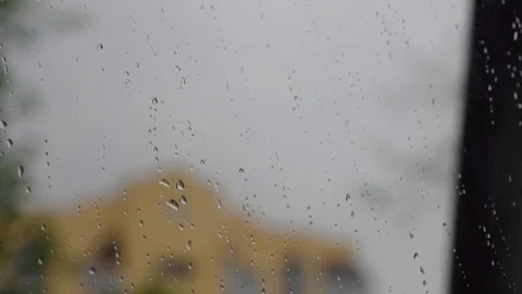 Raindrops on the window against the background of the city Stock Footage 129187298