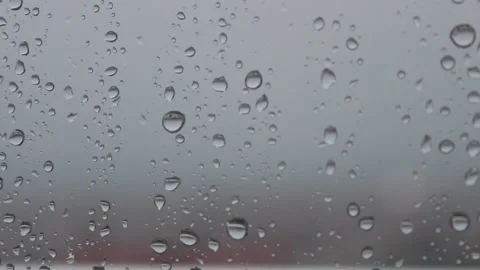Raindrops on the window and lightning in the background Stock Footage 135682865