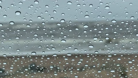 Raindrops on window and waves Stock Footage 202859633