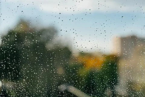 Raindrops on Window with Blurred Autumn View Stock Photos