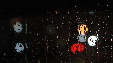 Raindrops on the window,  blurry view of city lights Stock Footage 164718848