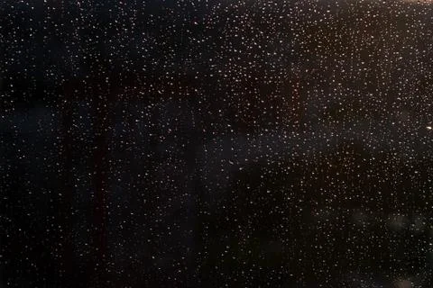 Raindrops on window close up. Stock Photos
