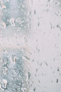 Raindrops on the window close-up. Stock Photos