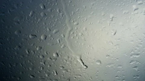Raindrops on the window dripping down, autumn season, monsoon time, slow motion Stock Footage 255315797