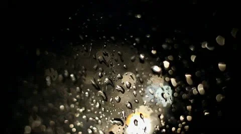 Raindrops on window of driving car Video stock 18858094