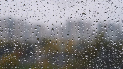 Raindrops on window. A drops of rain flows down the window. Drops of water Stock Footage 121286516
