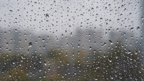 Raindrops on window. A drops of rain flows down the window. Drops of water Stock Footage 121286814