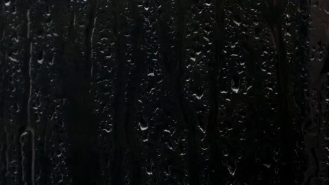 Raindrops on a window during night storm in city Stock Footage 118555215