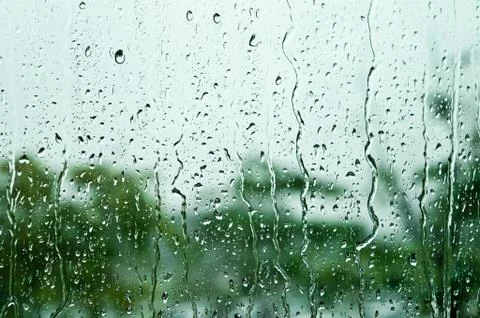 Raindrops on window glass, background Stock Photos