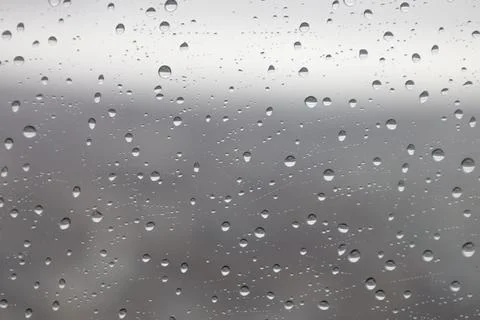 Raindrops on Window Glass Background Texture Stock Photos