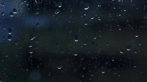 Raindrops On The Window Glass, Buildings In The Background. View From The Wi Stock Footage 124009894