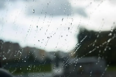 Raindrops on the window glass close up Stock Photos