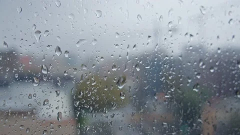 Raindrops on window glass in cloudy day on urban industrial background Stock Footage 165052610
