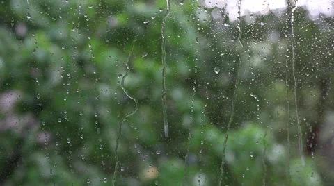 Raindrops on window glass, dripping, heavy rain, weather, background,slow motion Stock Footage 37775652