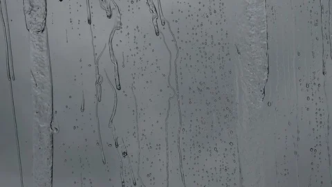 Raindrops on window glass Stock Footage 129970533