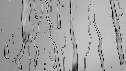 Raindrops on window glass Stock Footage 129970624
