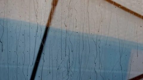 Raindrops on window glass Video stock 129970631