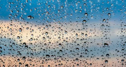 Raindrops on window glass Stock Photos