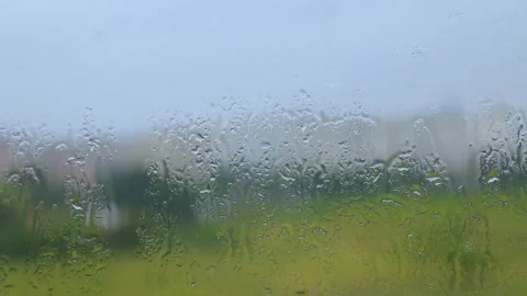 Raindrops on the window glass. Raindrops on the window pane. Stock Footage 246592639