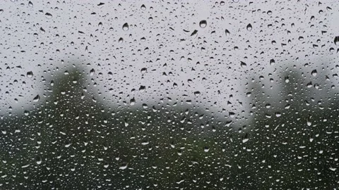 Raindrops on window glass surface, close-up. Stock Footage 201316523