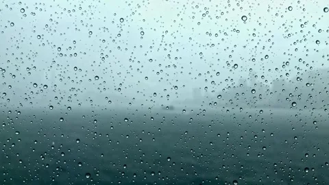 Raindrops on window glass surface Stock Footage 296143290