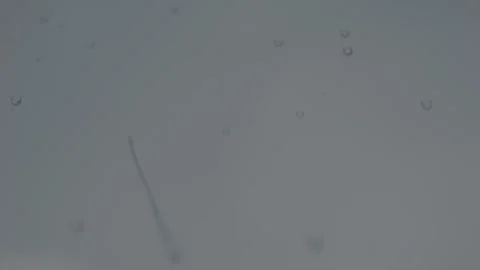 Raindrops on window glass surface on a gloomy rainy day Video stock 318415958