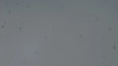 Raindrops on window glass surface on a gloomy rainy day 스톡 동영상 318415964
