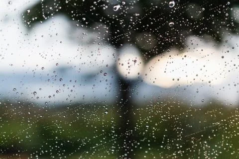Raindrops on window glasses surface Stock Photos