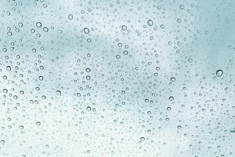 Raindrops on window glasses surface Stock Photos