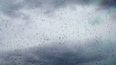 Raindrops on the window hitting the glass Stock Footage 159067149