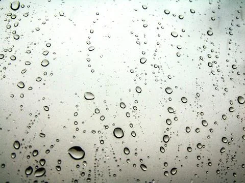 Raindrops on a window - house Stock Photos