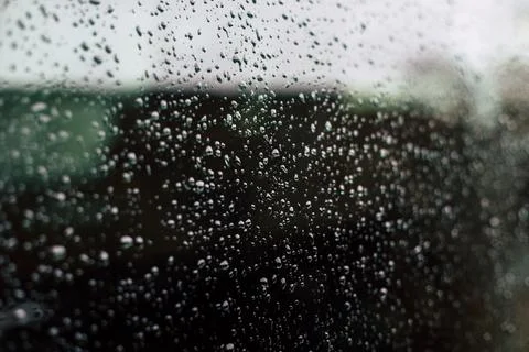 Raindrops on a window macro shot Stock Photos