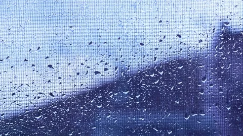 Raindrops on window mosquito net, weather and climate background, 4K Stock Footage 306937933