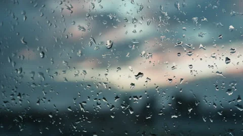 Raindrops on a window. Outside, the view of the city. Melancholy.  動画素材 60617215