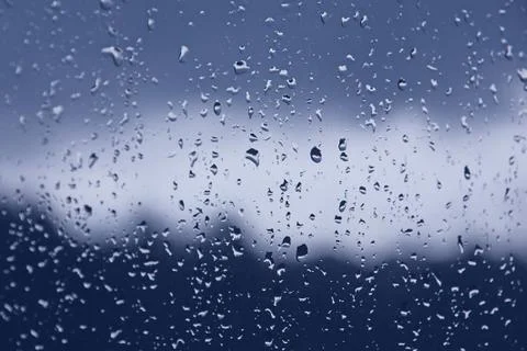 Raindrops on the window pane. Black, gray, white gradient on blurry backgroun Stock-Fotos