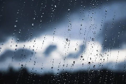 Raindrops on the window pane. Black, gray, white gradient on blurry backgr... Stock Photos