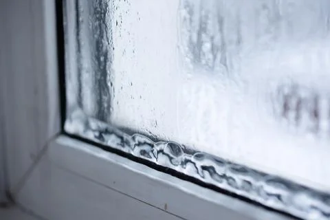Raindrops on a window pane capture natures beauty, creating a cozy, artistic Stock Photos