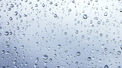 Raindrops on a window pane close-up Video stock 232685348