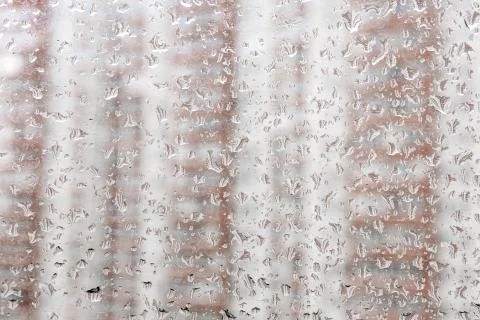 Raindrops on a window pane. Cloudy weather, it is raining. Stock Photos
