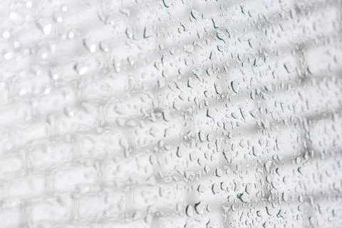 Raindrops on a window pane. Cloudy weather, it is raining. Stock Photos