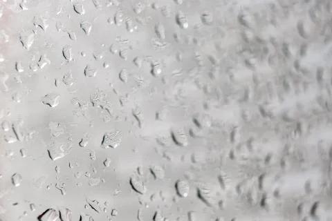 Raindrops on a window pane. Cloudy weather, it is raining. Stock Photos