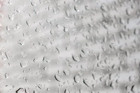 Raindrops on a window pane. Cloudy weather, it is raining. Stock Photos