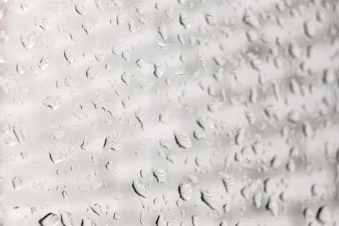 Raindrops on a window pane. Cloudy weather, it is raining. Stock Photos