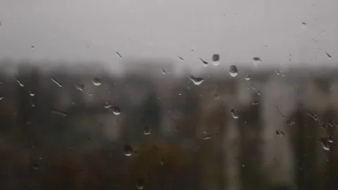 Raindrops on the window pane. Concept of bad weather, depression. Stock Footage 262574595